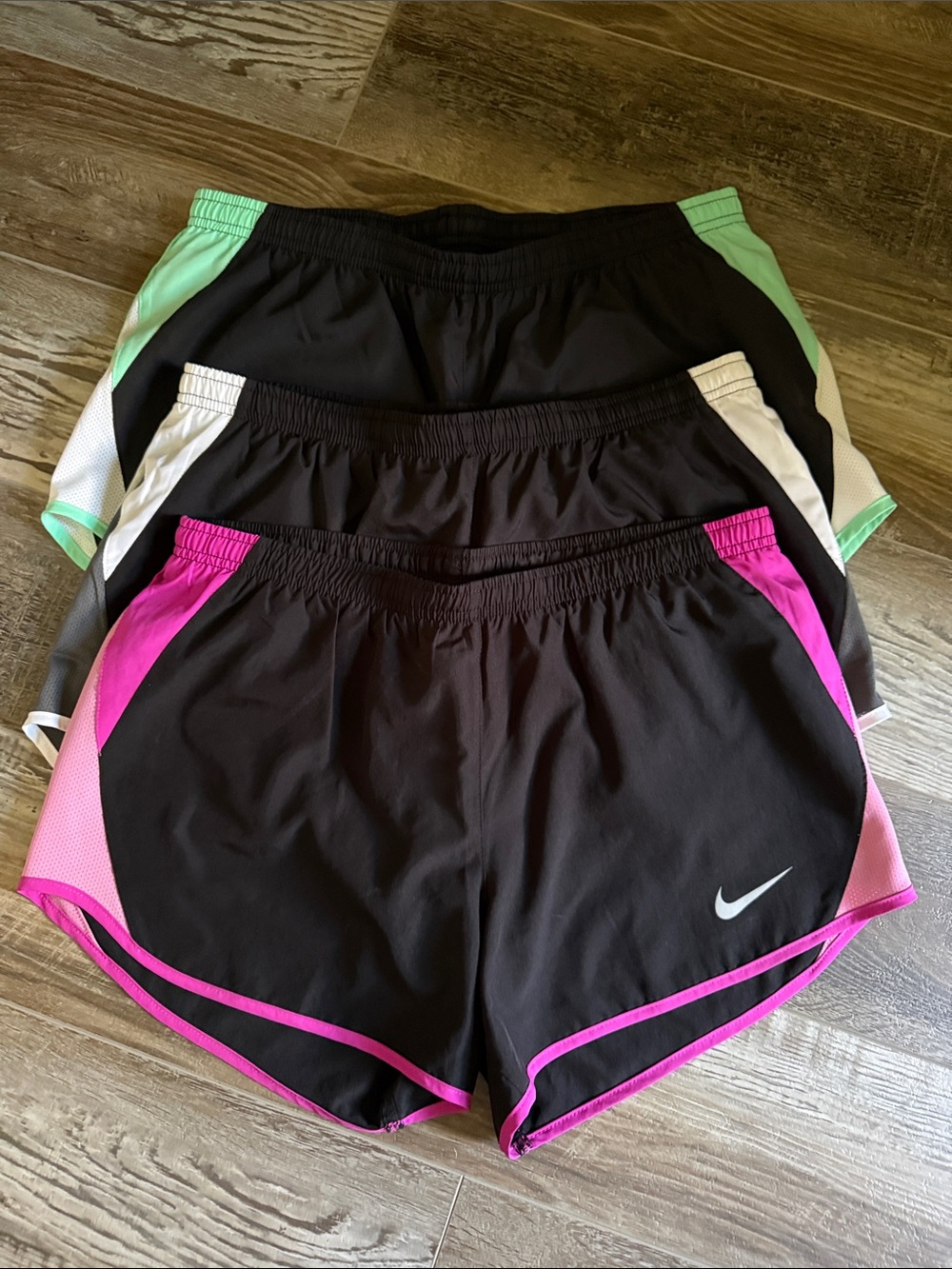 Nike dry fit women’s medium running shorts with liner. All 3 pairs included